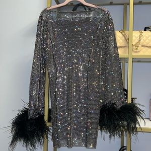 Black dress with feather rim on sleeves